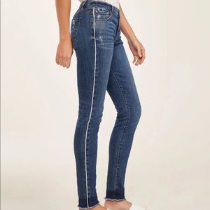 Blue jeans with white stripe